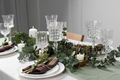 Stylish elegant table setting for festive dinner indoors