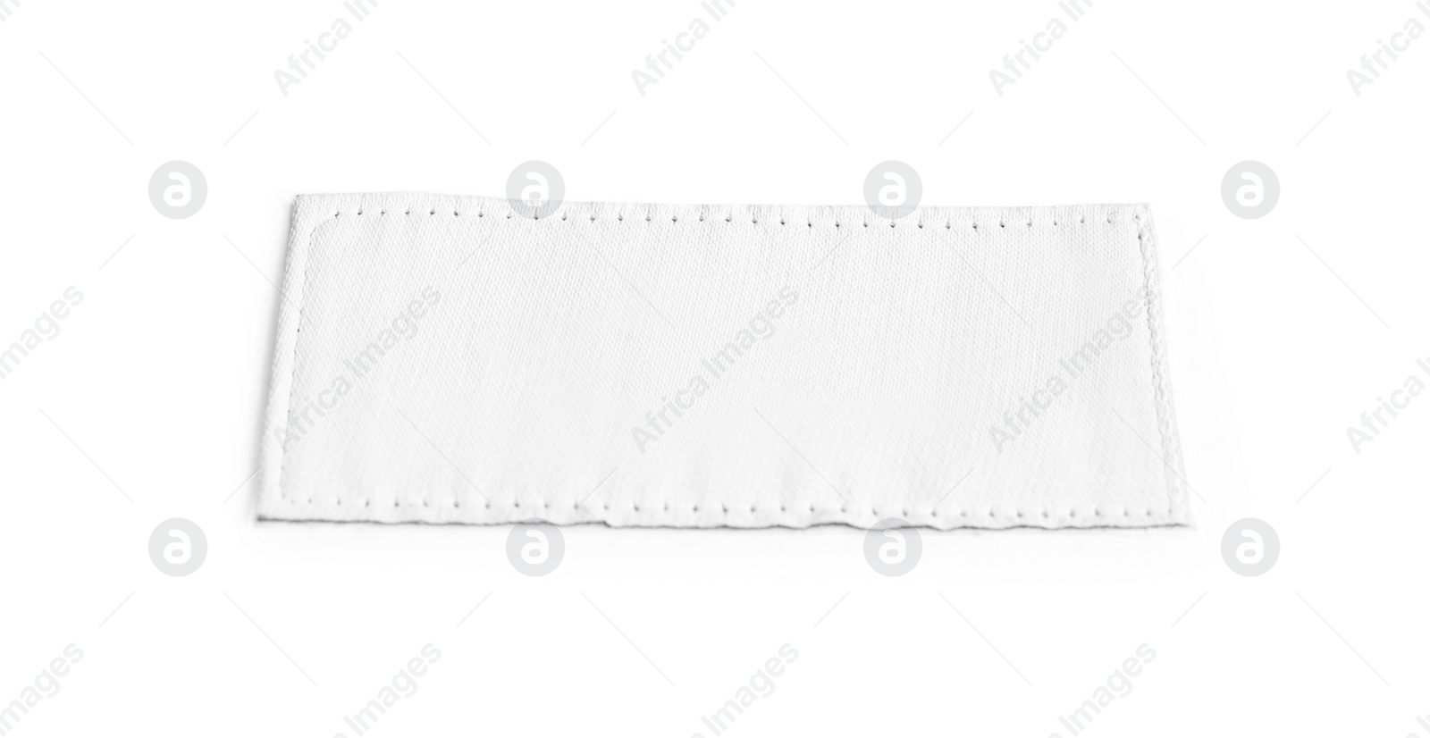 Photo of Blank stylish clothing label isolated on white