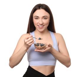 Photo of Happy woman eating tasty granola with fresh berries on white background