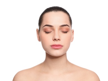 Portrait of young woman with beautiful face and natural makeup on white background