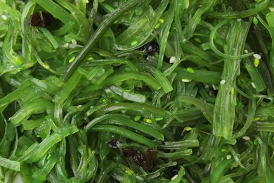 Photo of Tasty seaweed salad as background, top view