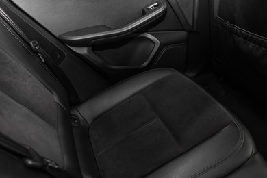 Leather seat inside of modern black car, closeup