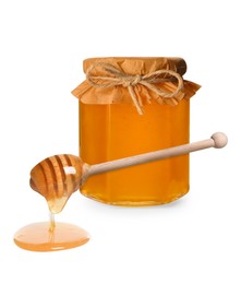 Natural honey dripping from dipper. Jar full of honey on white background