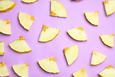 Flat lay composition with tasty melon on violet background