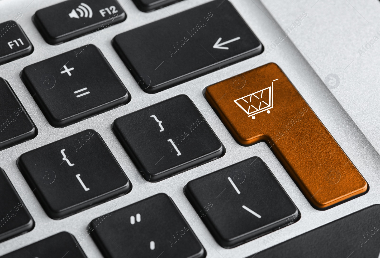 Image of Online store. Button with shopping cart on computer keyboard, closeup