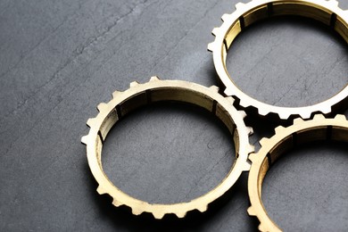Photo of Stainless steel gears on grey background, closeup