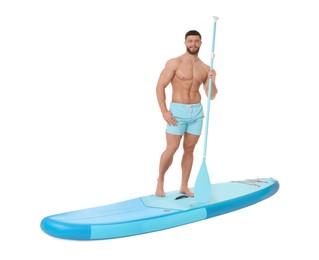 Happy man with paddle on blue SUP board against white background