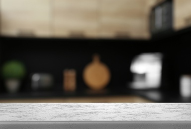 Image of White textured table in kitchen. Space for design