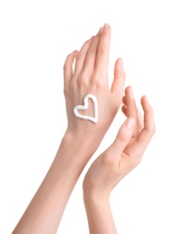 Young woman applying hand cream against on white background