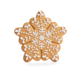 Photo of Tasty gingerbread cookie in shape of snowflake on white background. St. Nicholas Day celebration