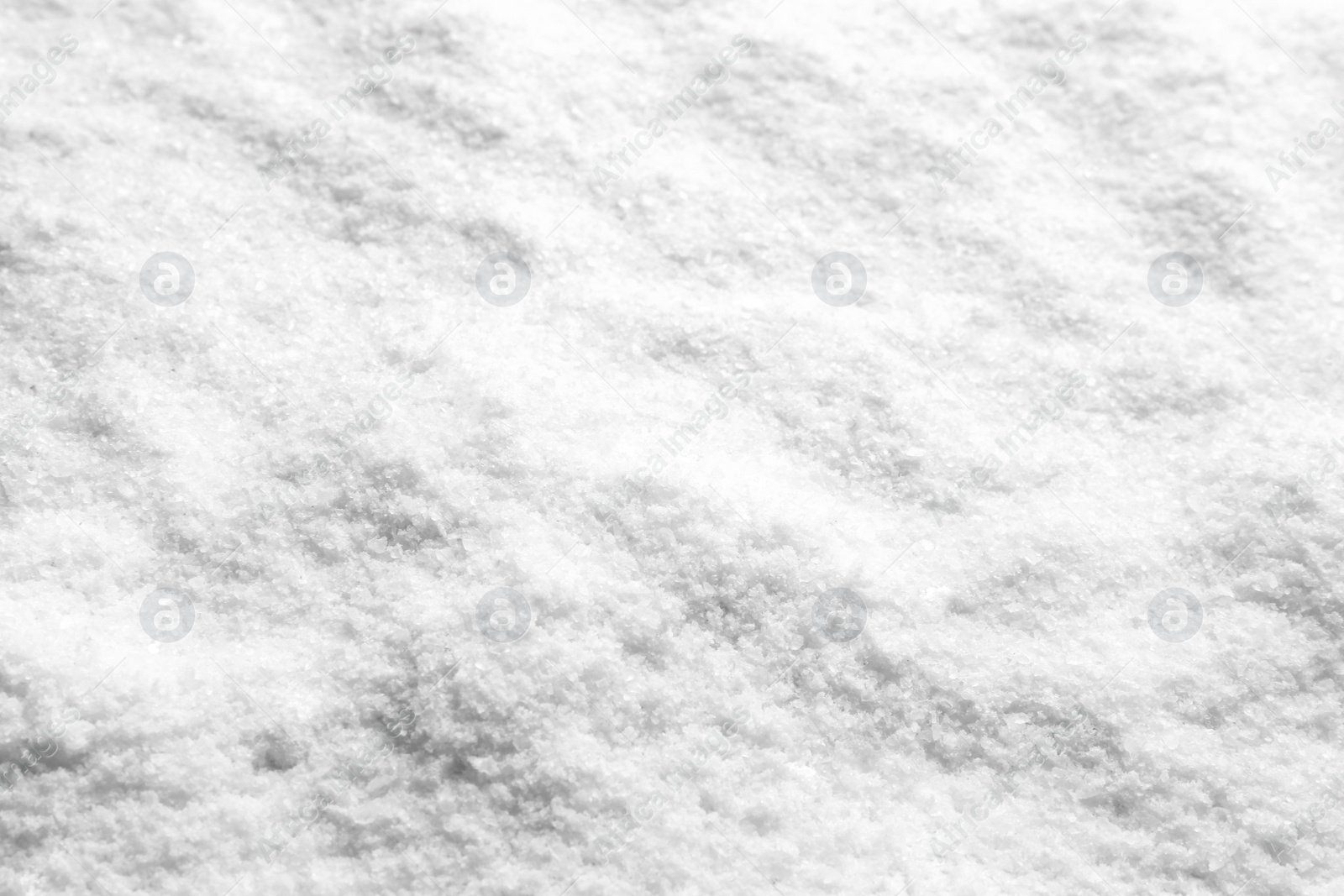 Photo of Natural white salt as background, closeup view