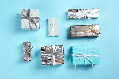 Photo of Flat lay composition with beautiful gift boxes on color background