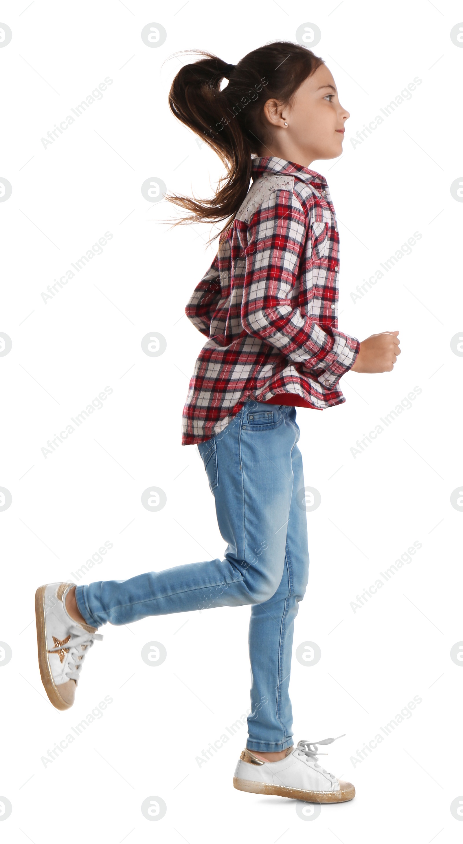 Photo of Cute little girl running on white background