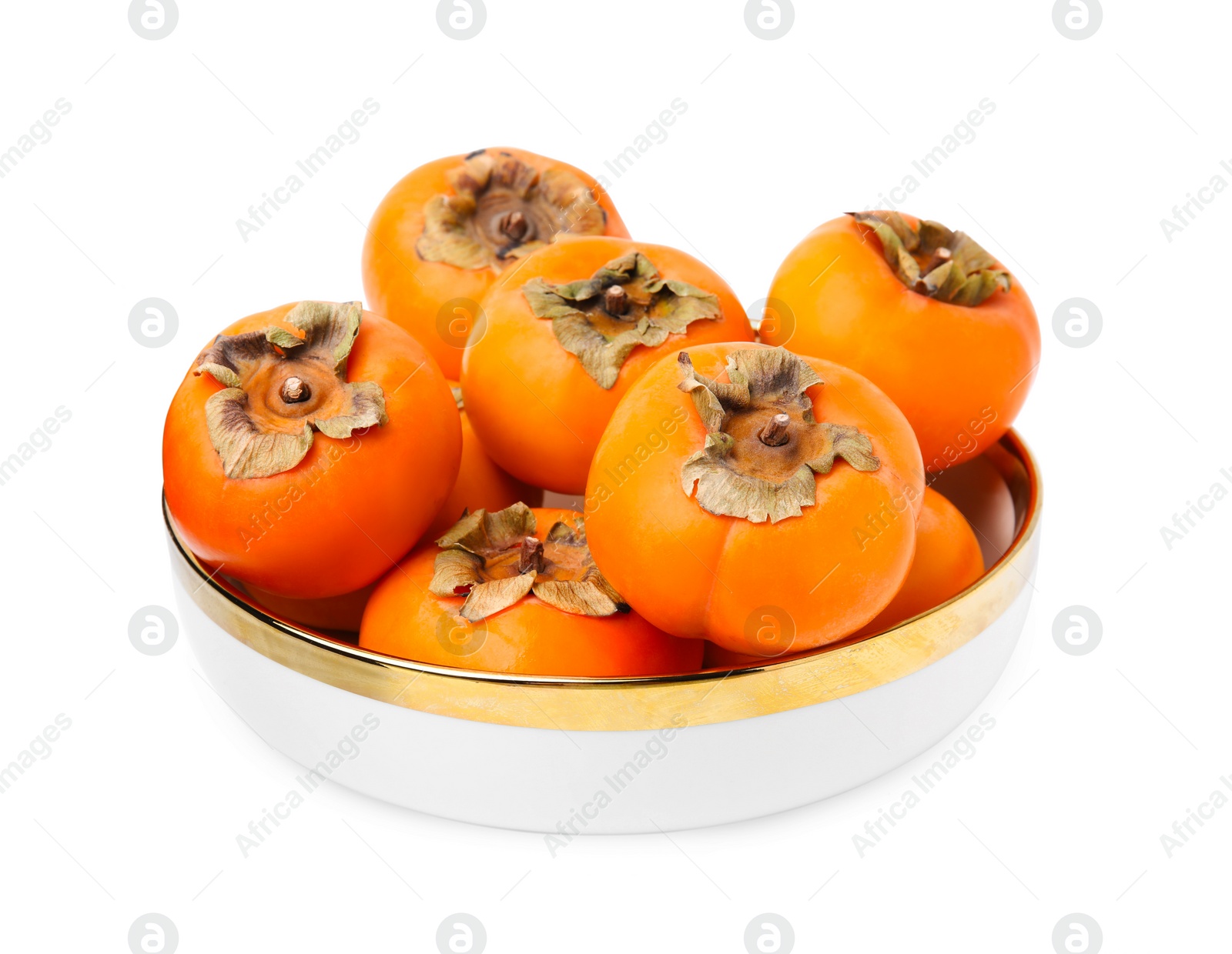 Photo of Bowl with whole delicious juicy persimmons isolated on white