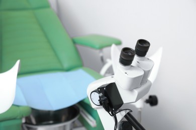 Photo of Gynecological checkup. Modern binocular colposcope in clinic, closeup. Space for text