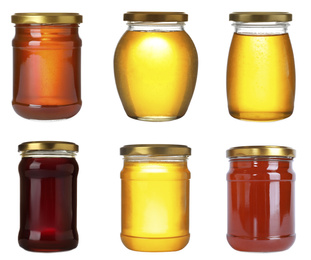 Image of Set of different jars with organic honey on white background