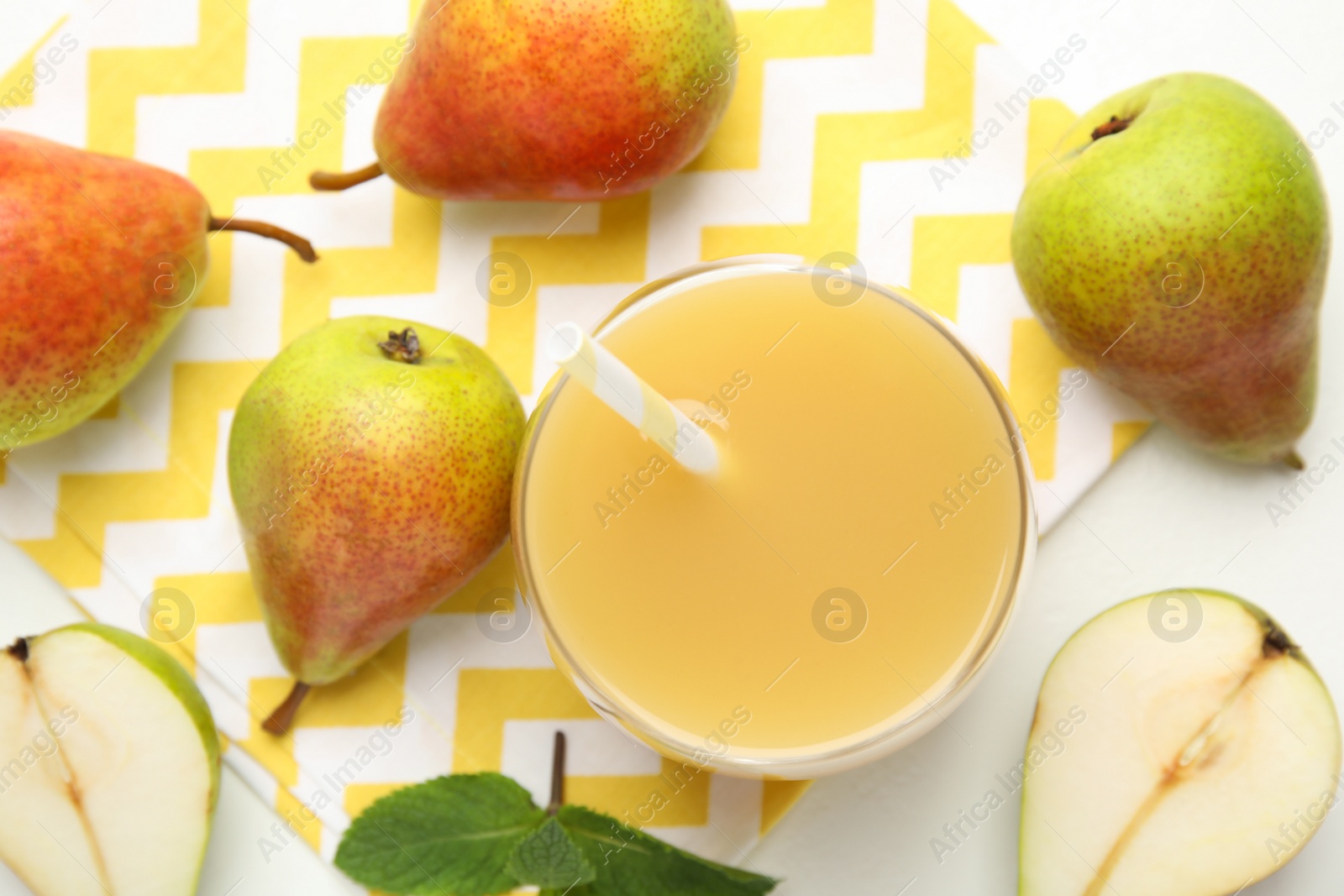 Photo of Tasty pear juice and fruits on white table, flat lay