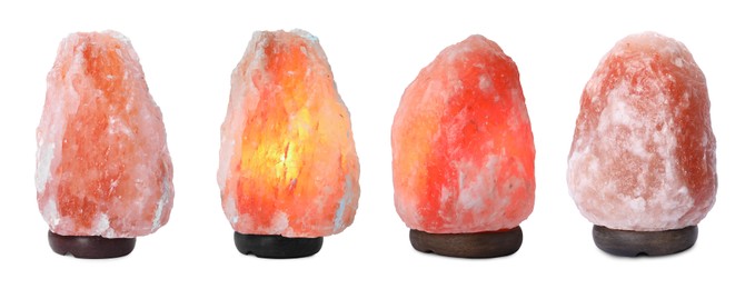 Set with pink Himalayan salt lamps on white background. Banner design 