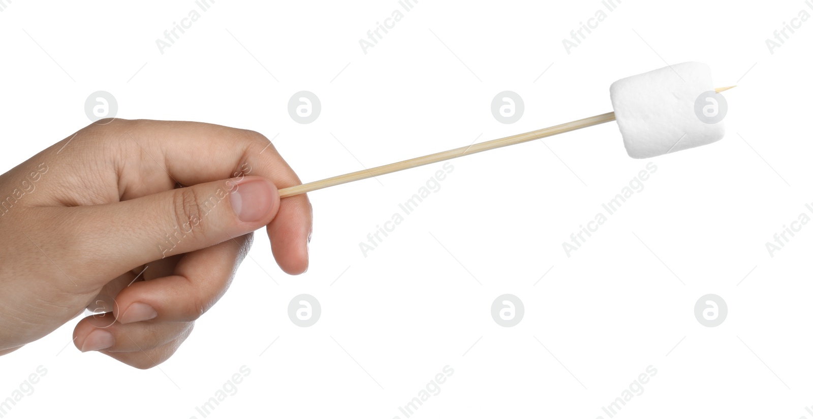 Photo of Woman holding stick with delicious puffy marshmallow on white background, closeup