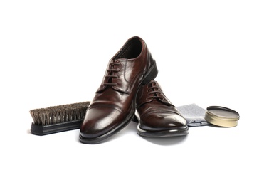 Photo of Stylish men's footwear and shoe care accessories on white background