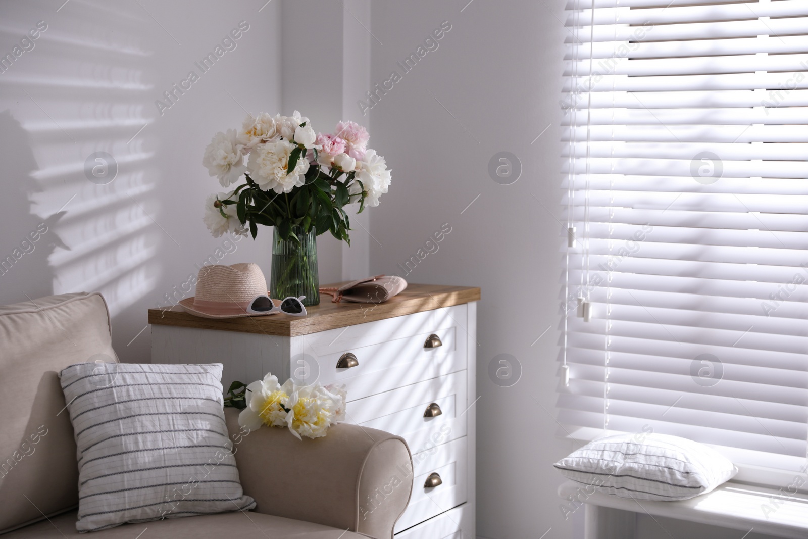 Photo of Bouquet of beautiful peony flowers in room