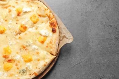 Photo of Hot cheese pizza Margherita on grey background, top view. Space for text
