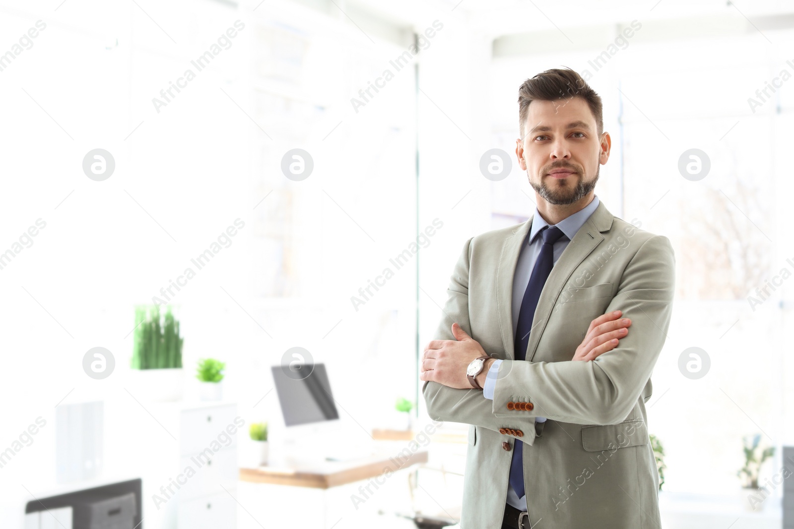 Photo of Male lawyer standing in light office