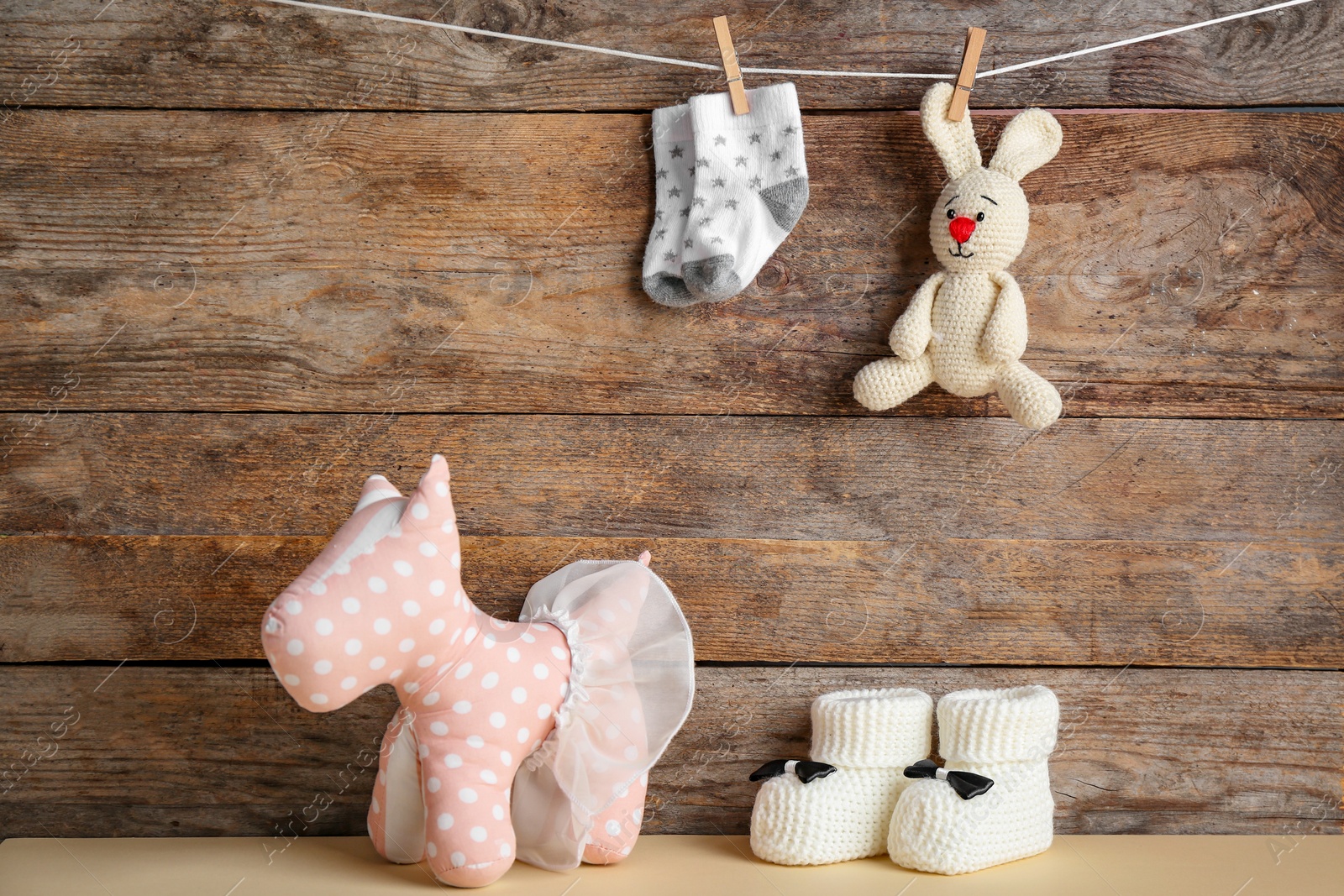 Photo of Composition with baby accessories on wooden background