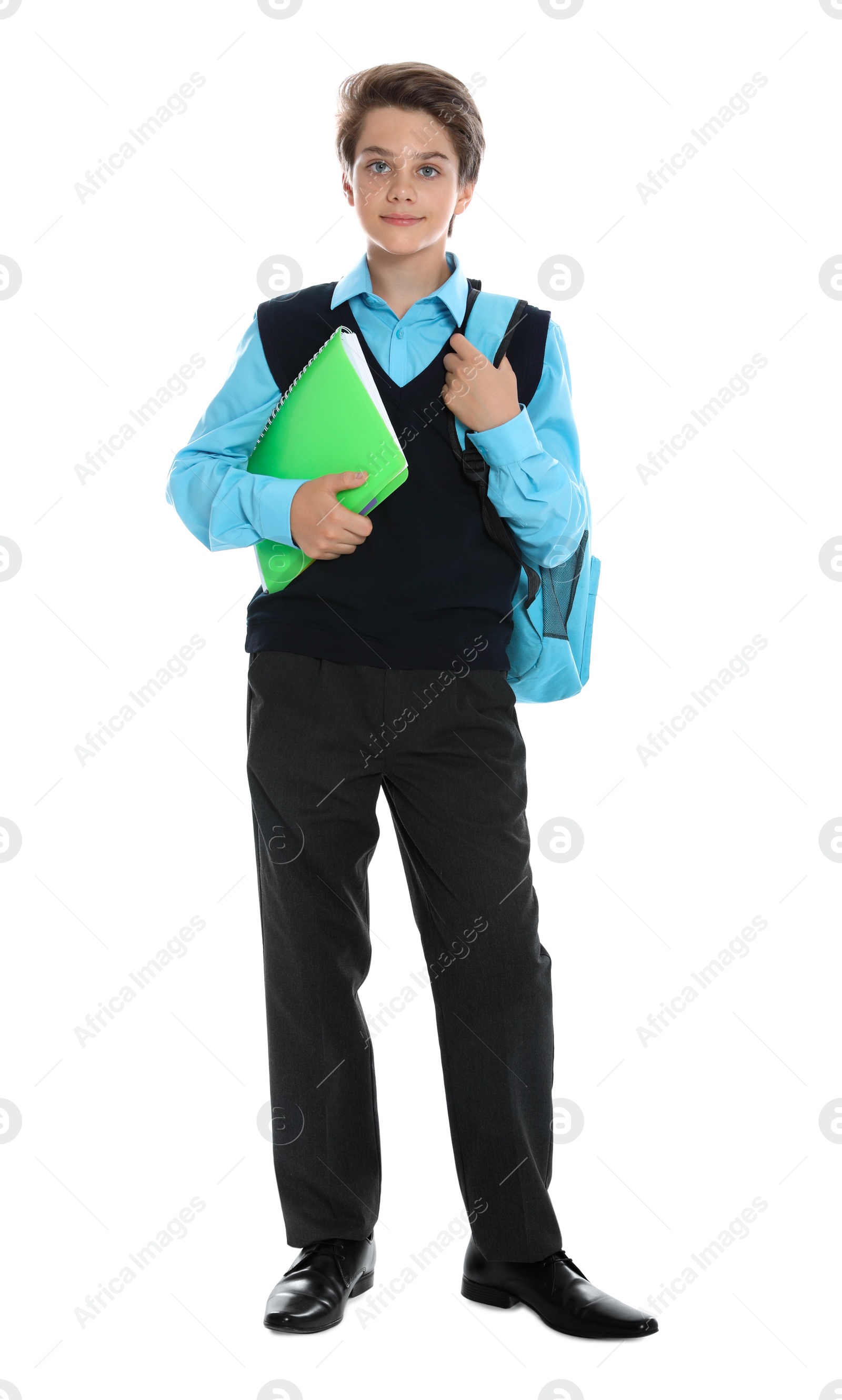 Photo of Happy boy in school uniform on white background