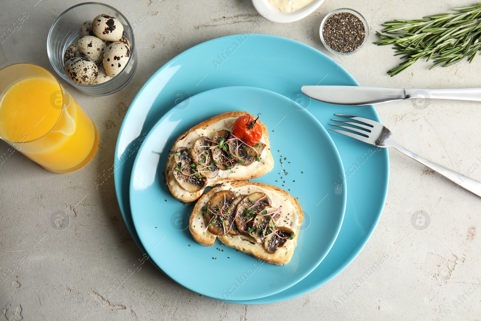 Photo of Tasty toasts with mushrooms, sprouts and chia seeds served on table, top view