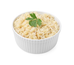 Photo of Cooked bulgur with parsley in bowl isolated on white