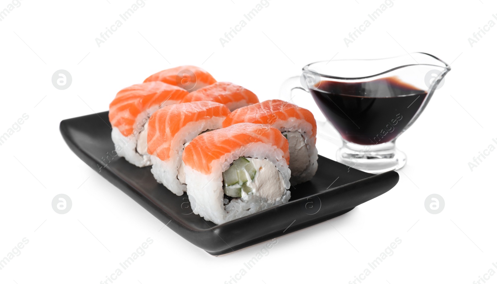 Photo of Tasty sushi rolls and soy sauce on white background