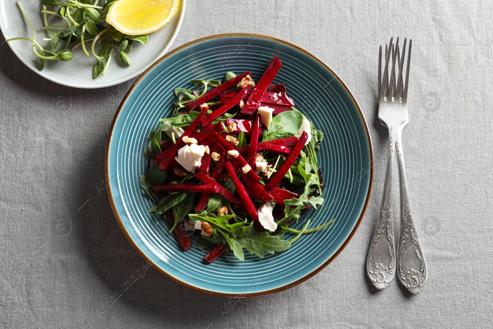 Photo of Plate with delicious beet salad on table, top view