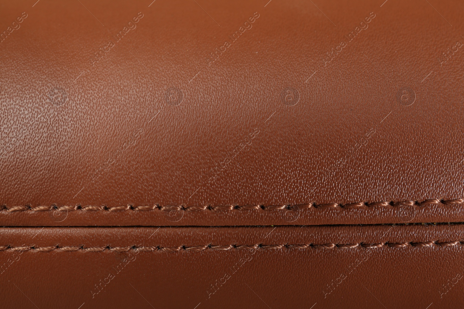 Photo of Texture of brown leather as background, top view