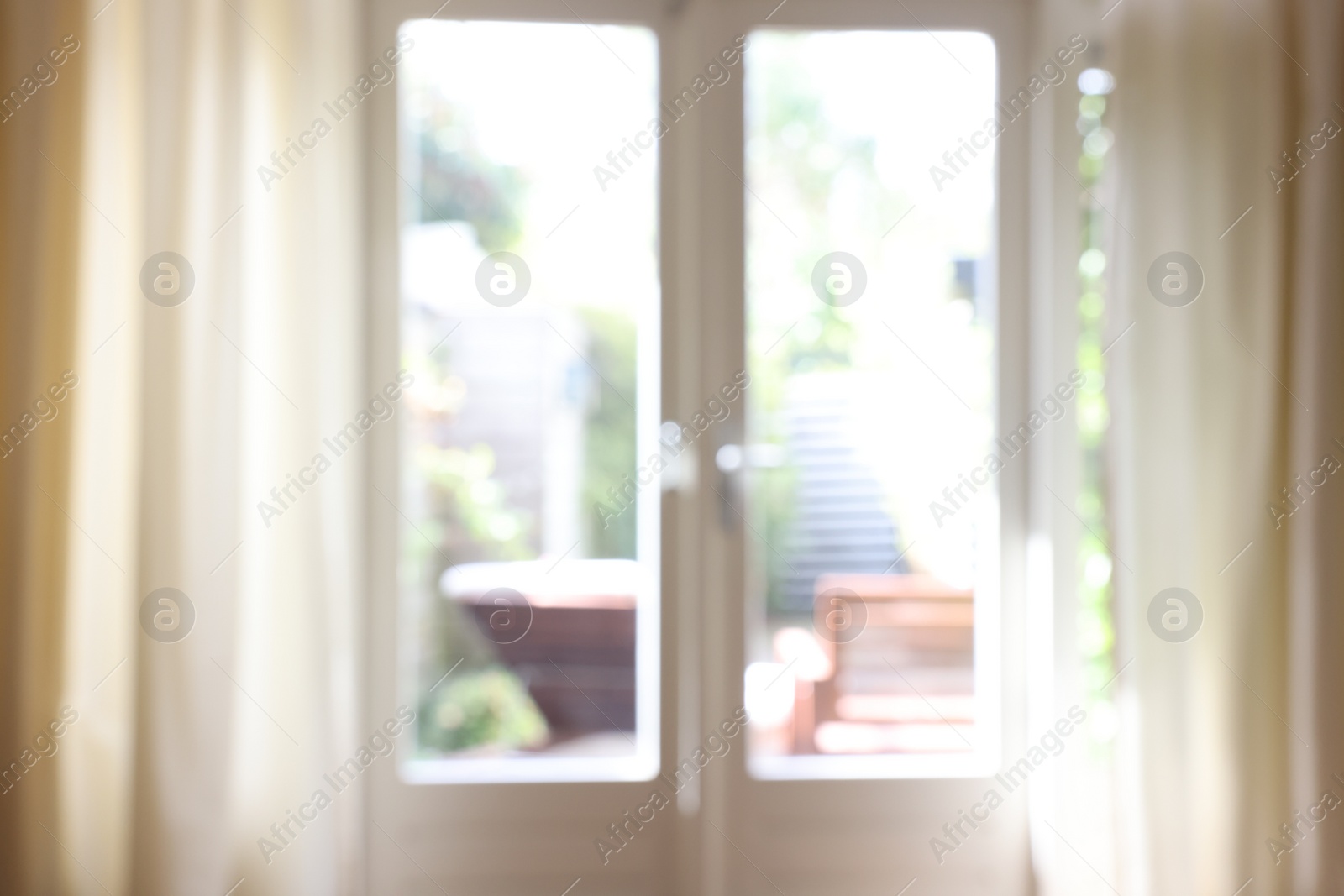 Photo of Blurred view of glass door at home