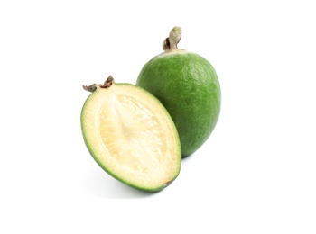 Photo of Cut and whole feijoas on white background