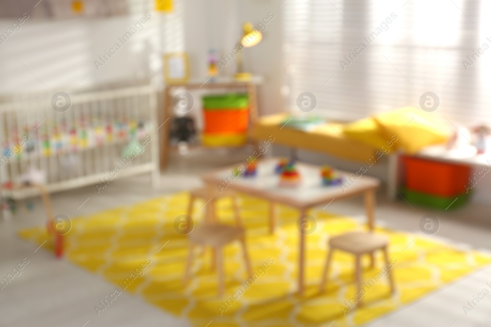Photo of Blurred view of cozy baby room interior