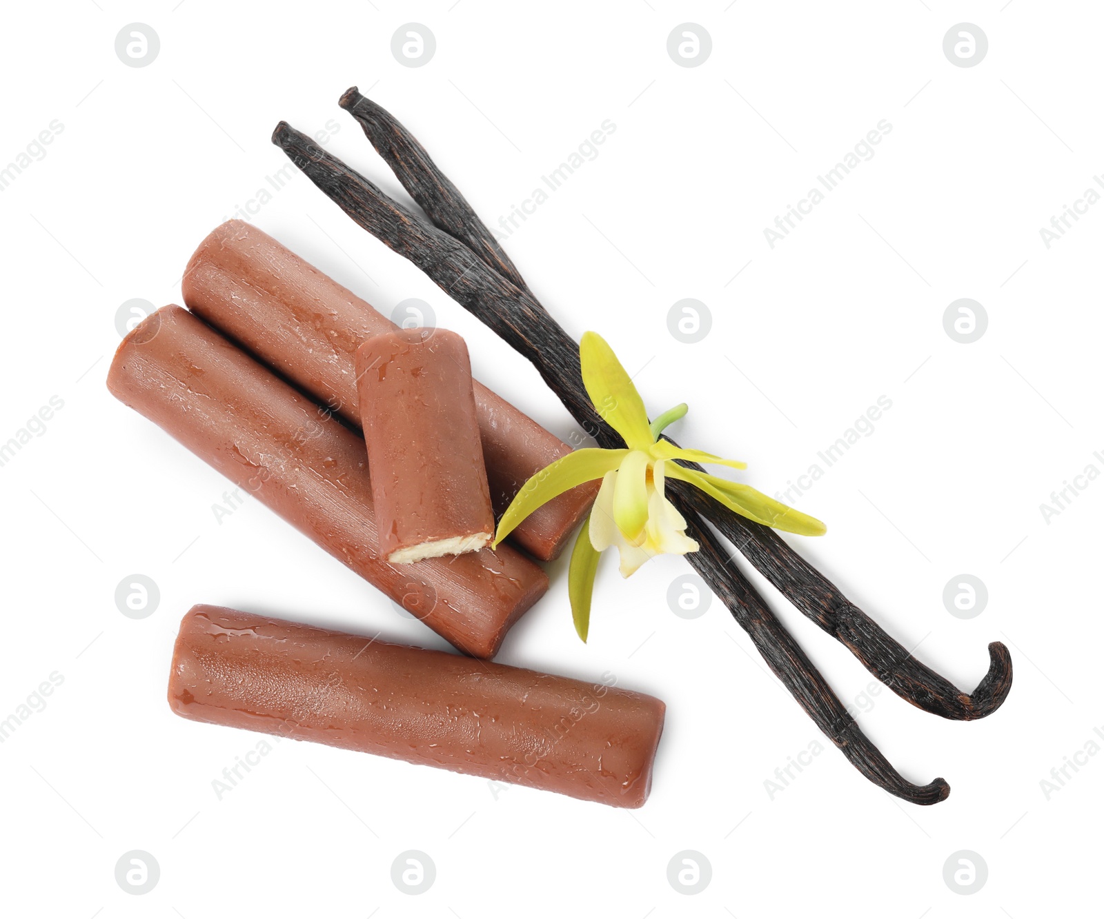 Photo of Glazed curd cheese bars, vanilla pods and flower isolated on white, top view