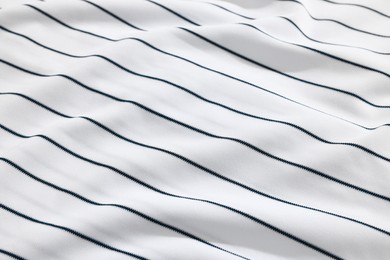 Photo of Striped baseball uniform as background, closeup view