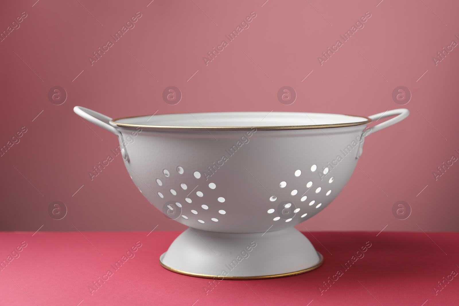 Photo of One clean empty colander on color background