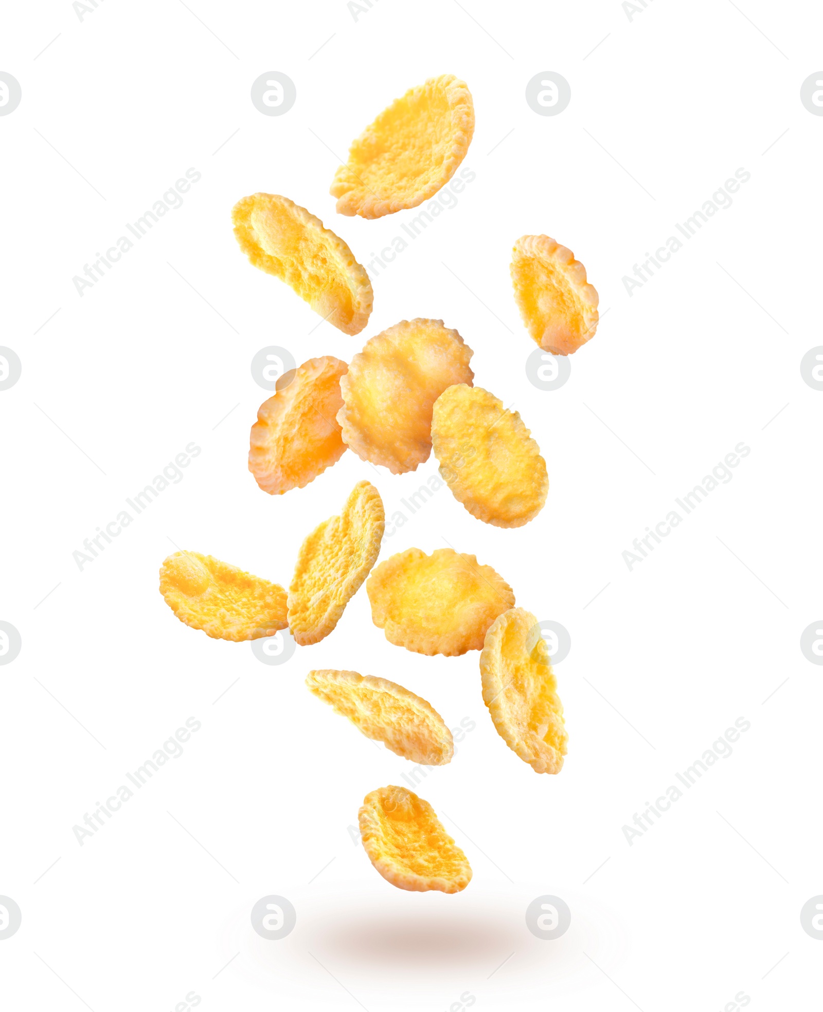 Image of Golden corn flakes falling on white background