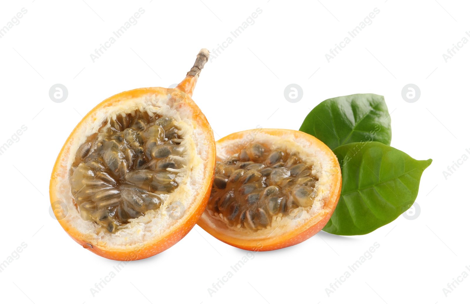 Photo of Halves of delicious ripe granadillas with green leaves isolated on white