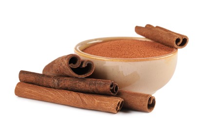 Dry aromatic cinnamon sticks and powder isolated on white