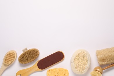 Bath accessories. Flat lay composition with personal care tools on white background, space for text