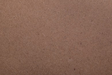 Photo of Texture of kraft paper bag as background, closeup