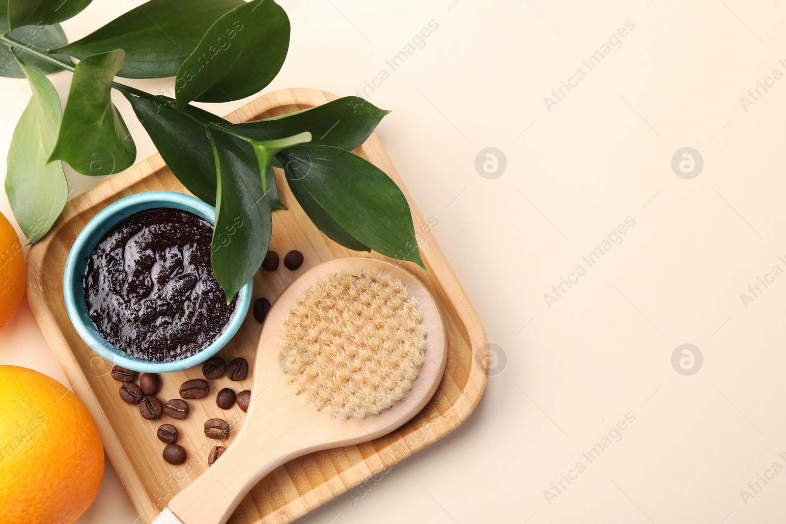 Photo of Flat lay composition with natural body scrub and fresh ingredients on beige background, space for text. Anti cellulite treatment