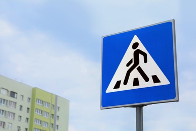 Photo of Traffic sign Pedestrian Crossing against cloudy sky, space for text