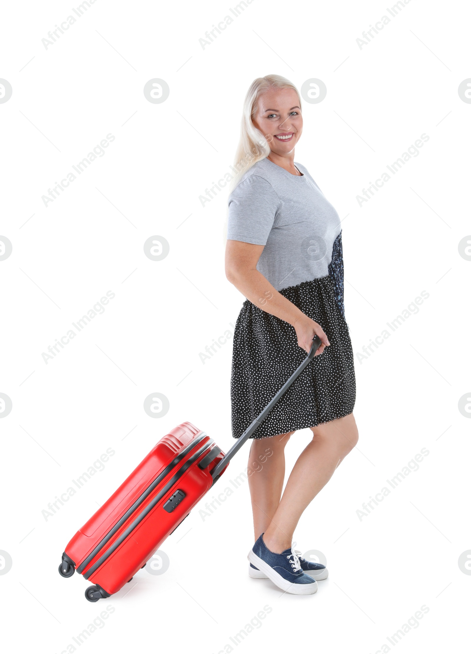 Photo of Senior woman with suitcase on white background. Vacation travel