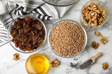 Ingredients for traditional kutia on white marble table, flat lay