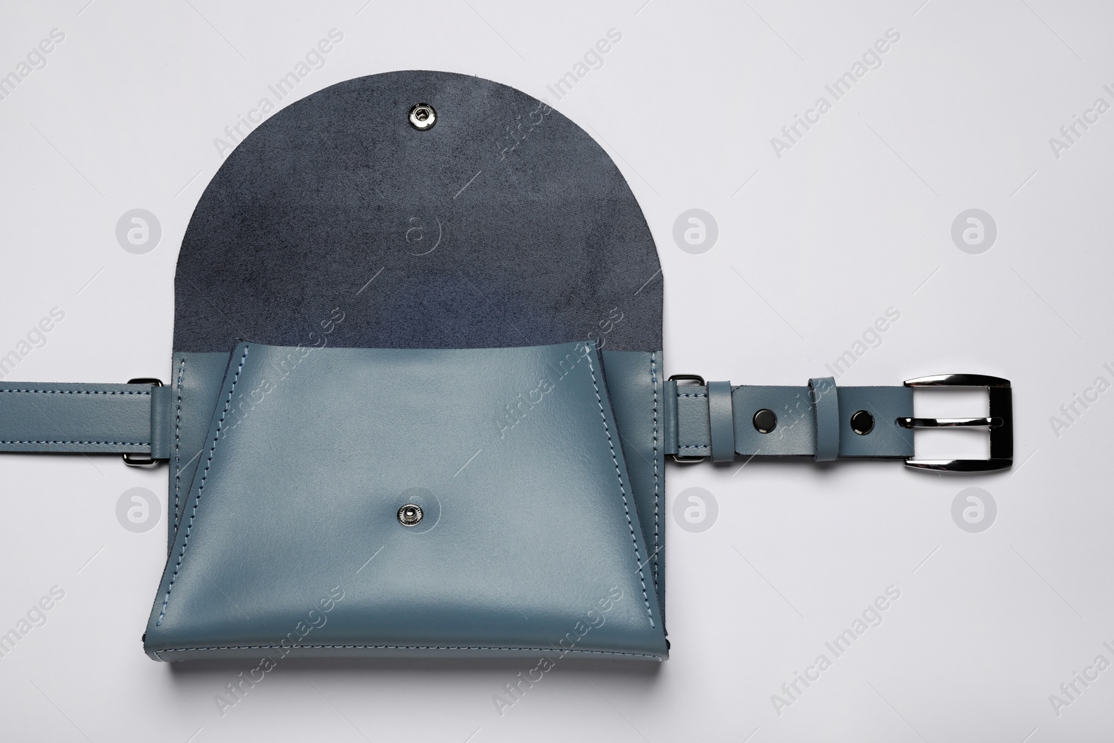 Photo of Stylish woman's bag on light background, top view